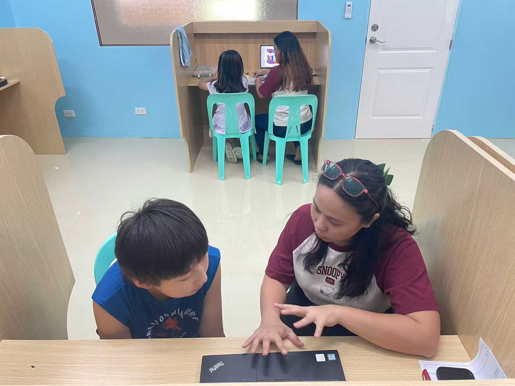 Student receiving monthly progress certificate